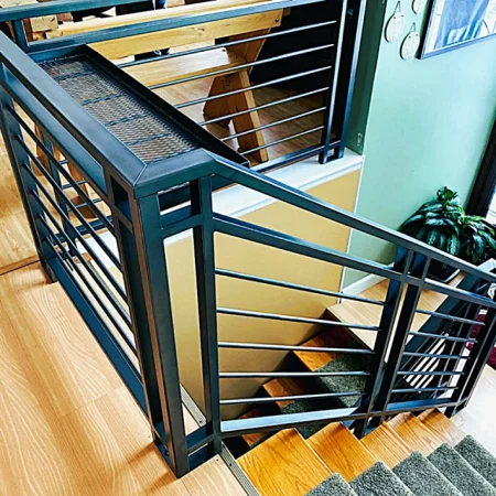 Custom-wrought-iron-railing-painted-graphite-stairs-1104x1104